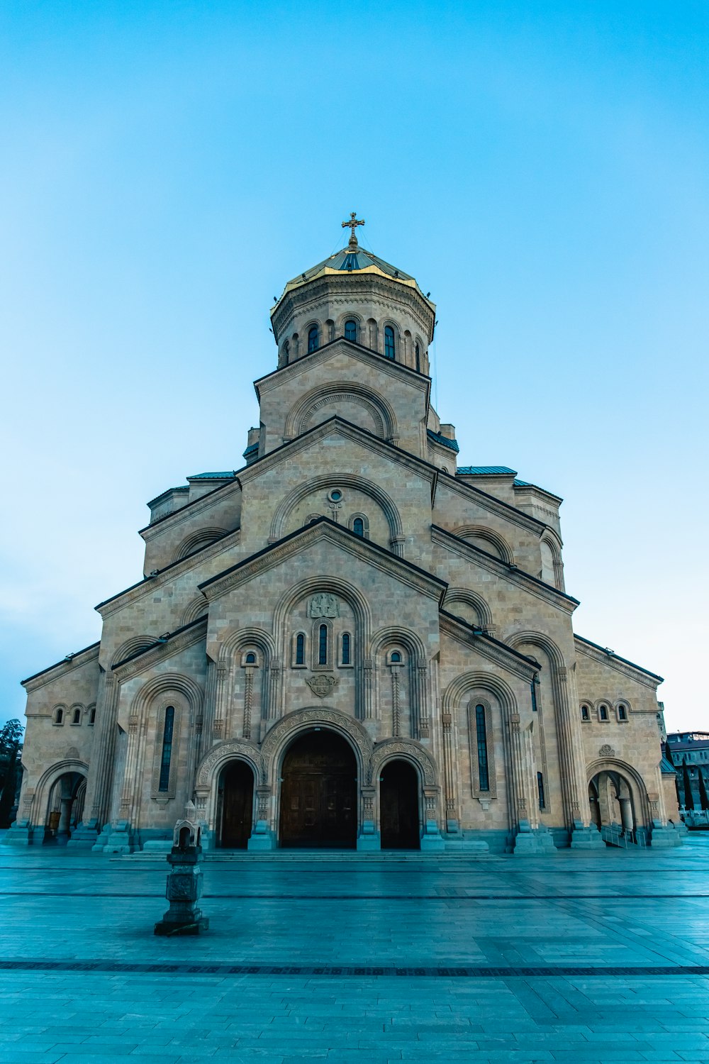 a large church with a clock on the front of it