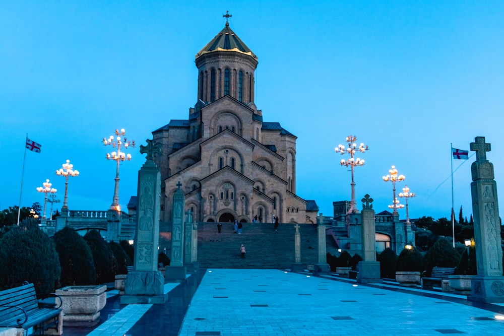 a large building with a clock tower at dusk