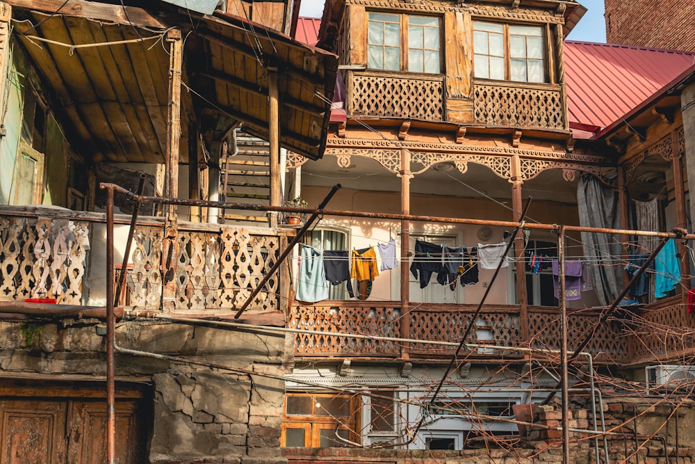 a balcony with clothes hanging on a clothes line