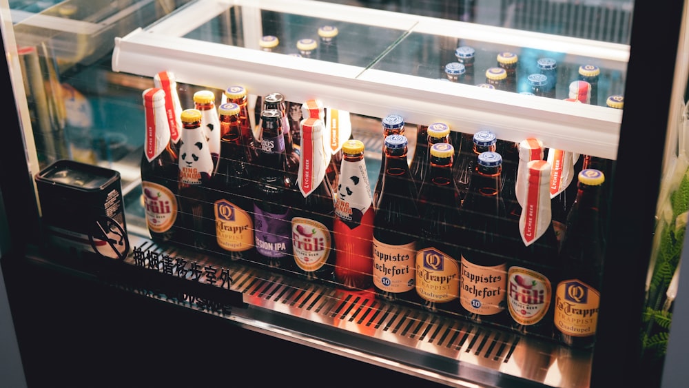 a display case filled with lots of bottles of beer