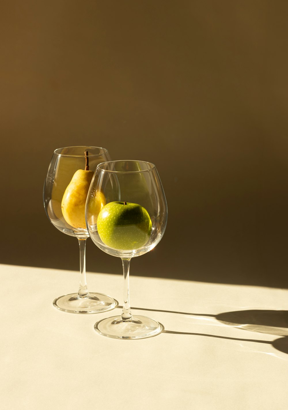 a couple of wine glasses sitting on top of a table