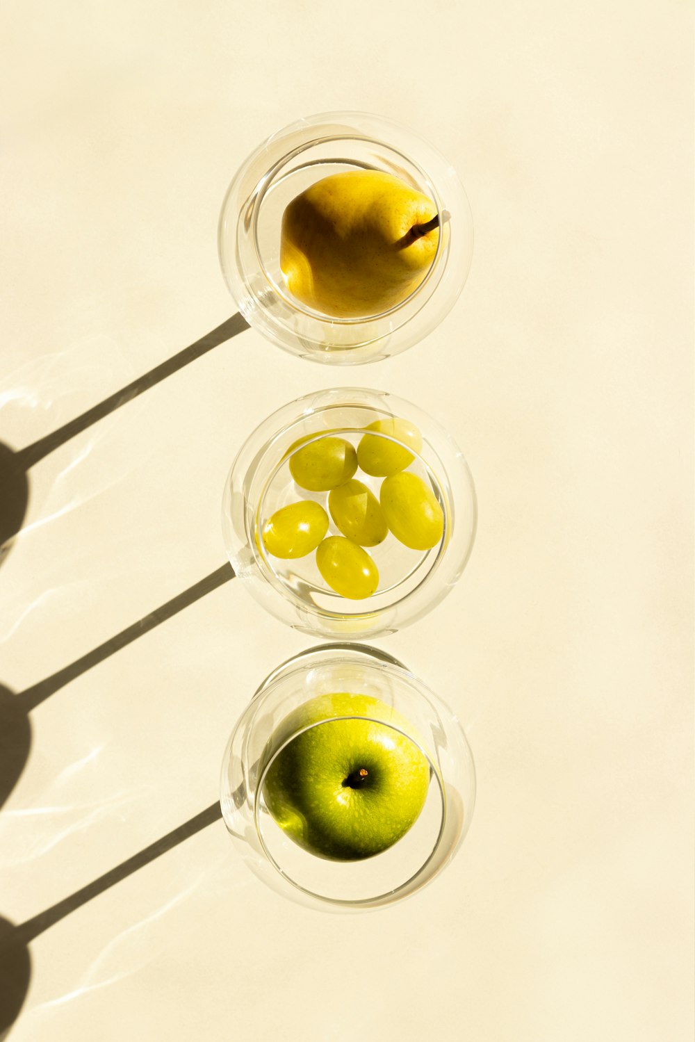 three bowls filled with different types of fruit