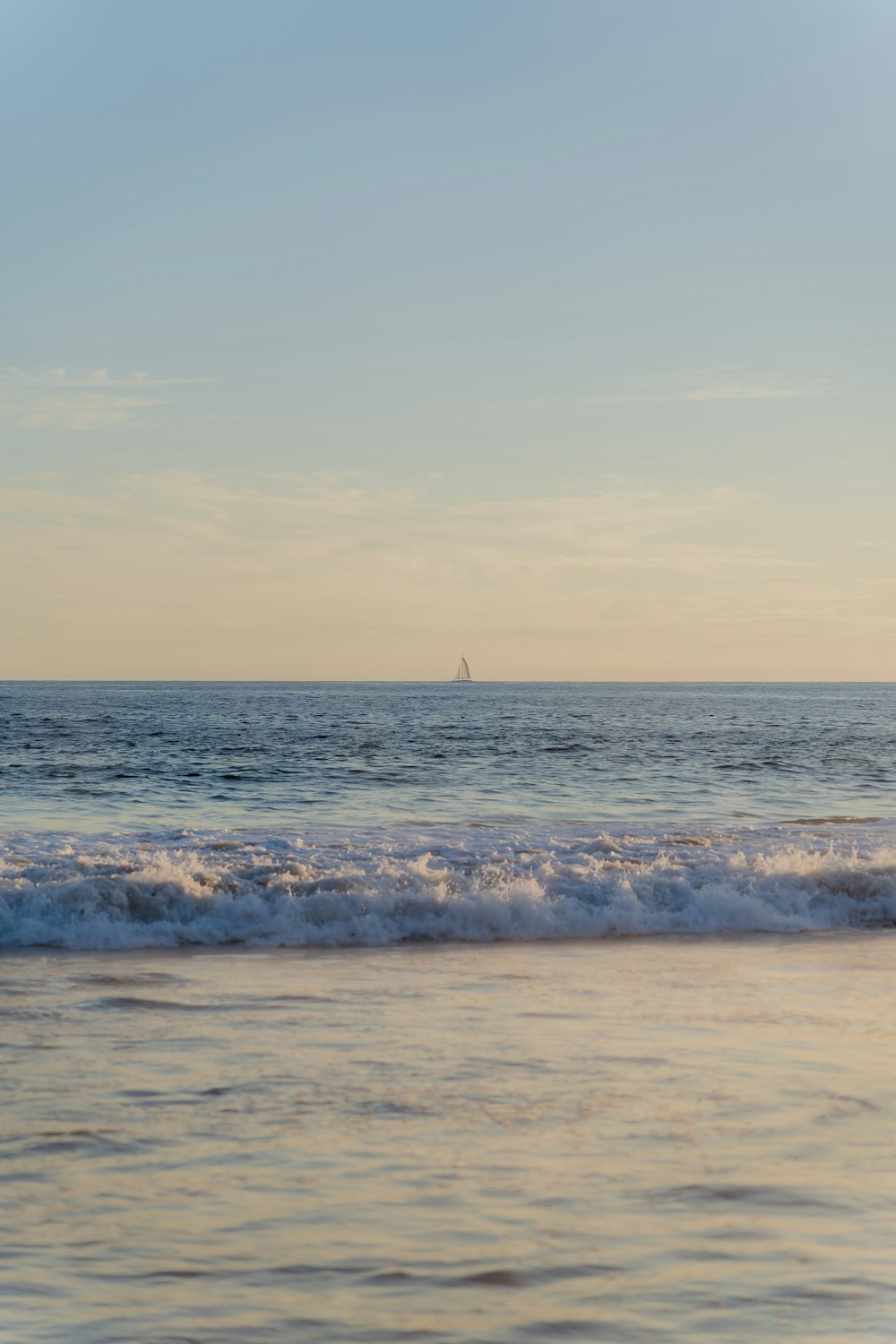 a person riding a surfboard on a wave in the ocean