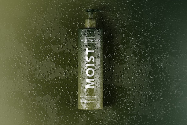 a bottle of alcohol sitting on top of a window