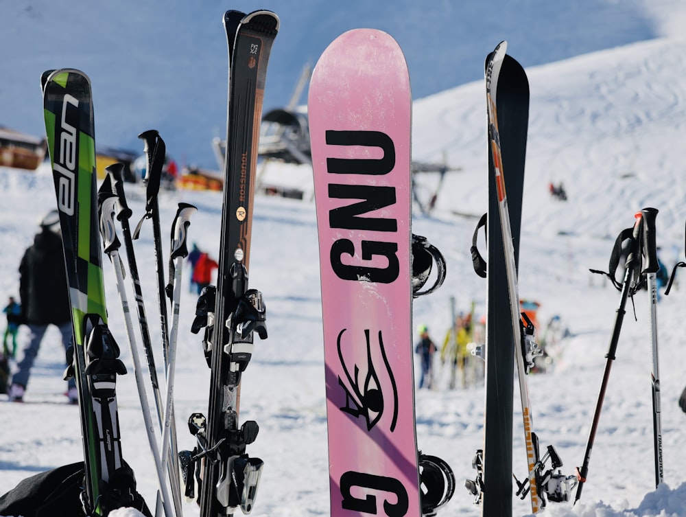 a group of skis and ski poles in the snow