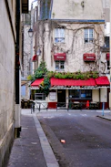 a building with a red awning on the side of it