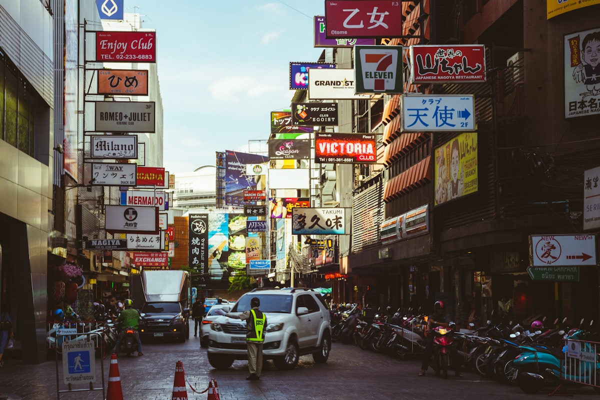 a busy city street filled with lots of signs