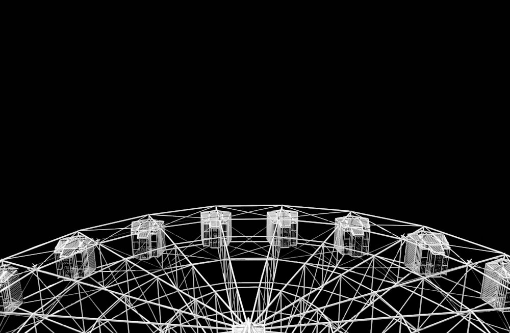 a black and white photo of a ferris wheel