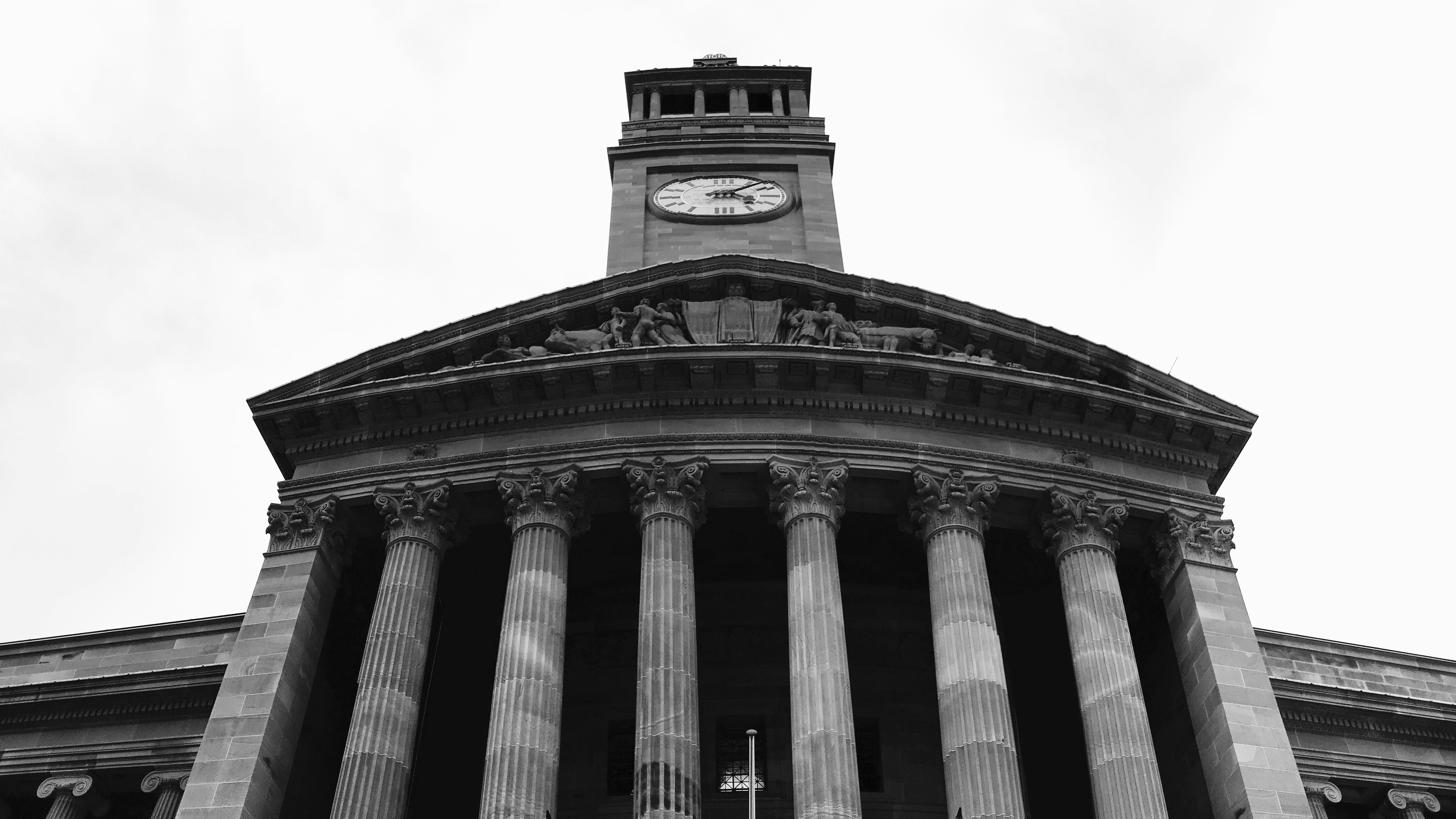 a tall building with a clock on the top of it