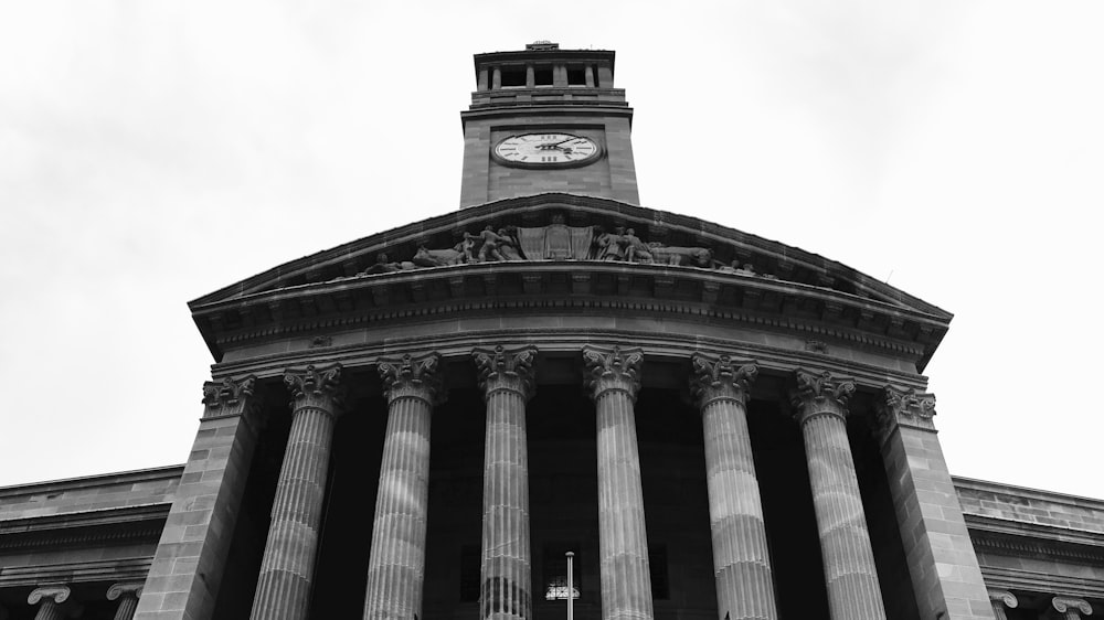 a tall building with a clock on the top of it