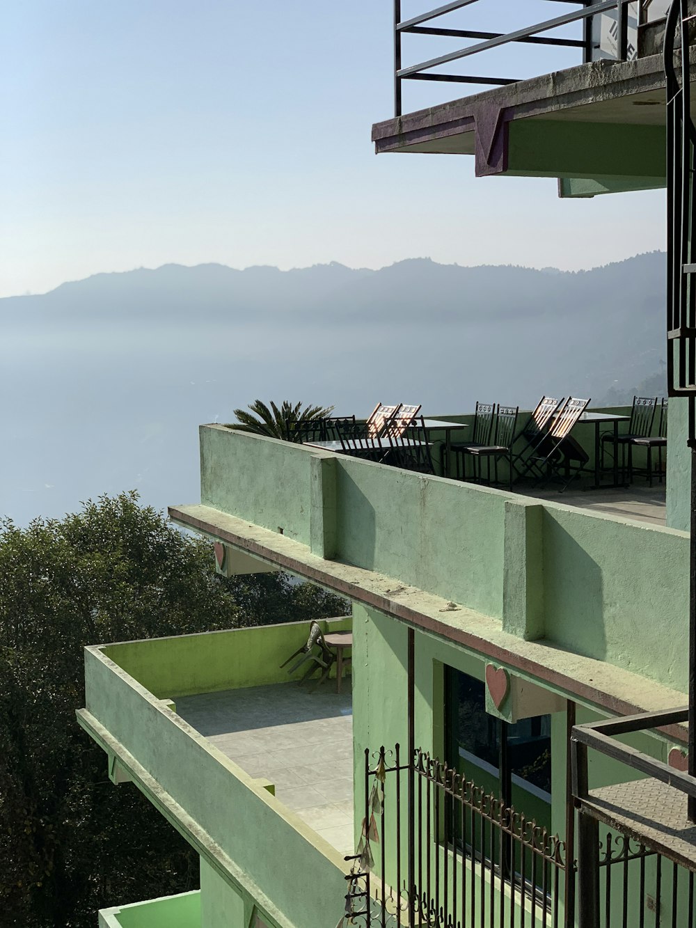 a building with a balcony and a view of the ocean