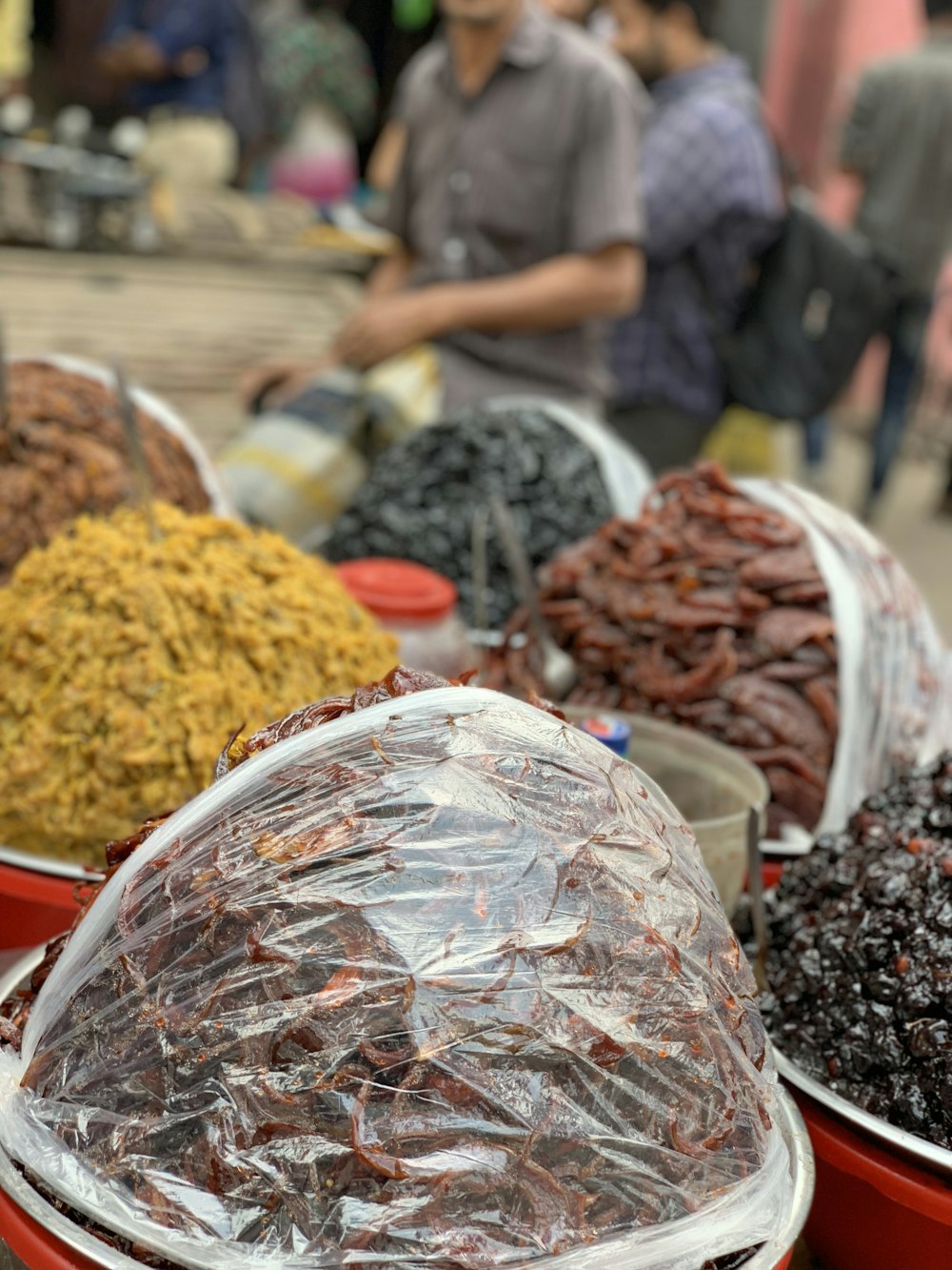 a table topped with bowls filled with raisins and raisins