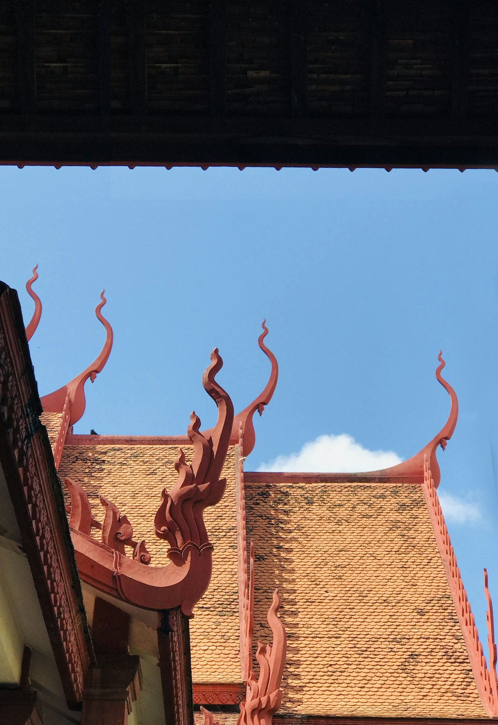 the roof of a building with a sky background