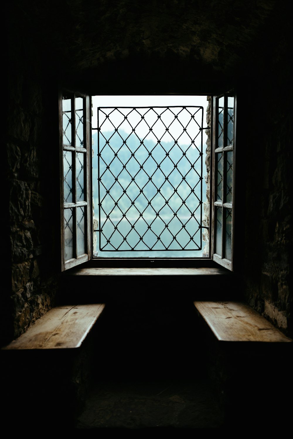 a window with a view of a body of water