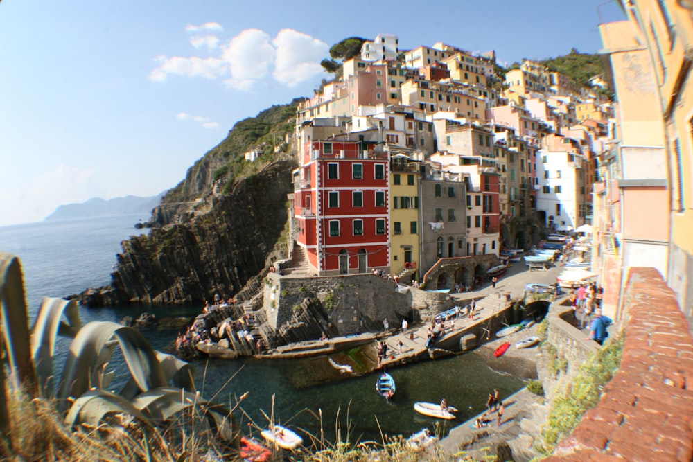 a view of a small town on the shore of a body of water