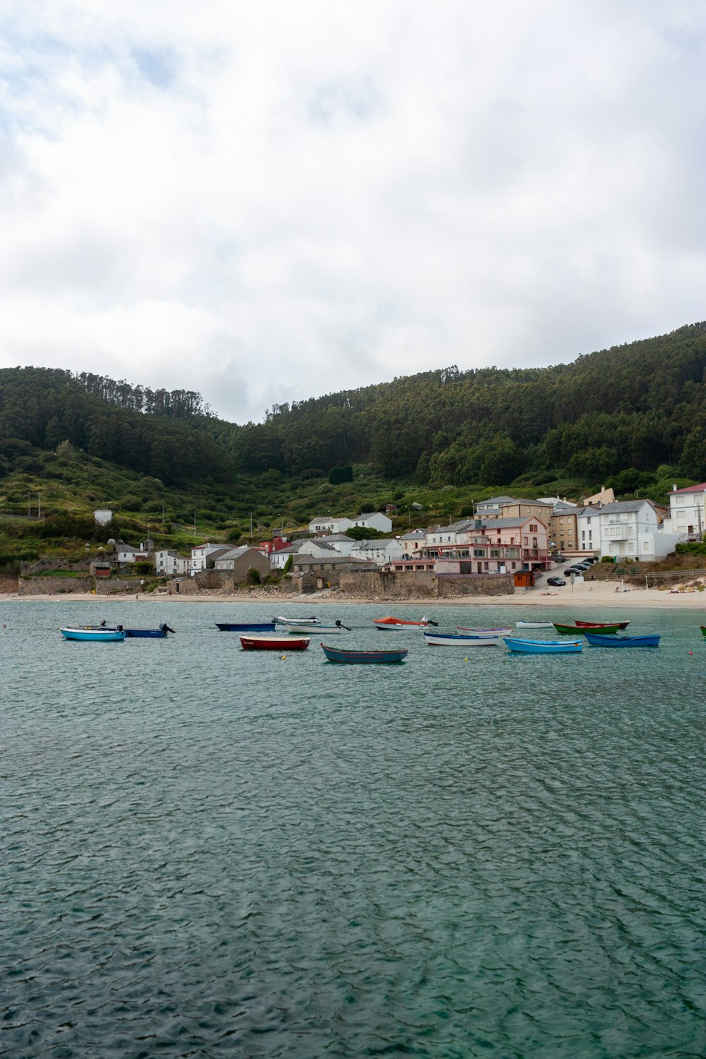 a group of boats floating on top of a body of water