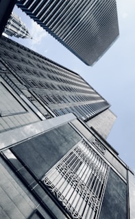 looking up at tall buildings in a city