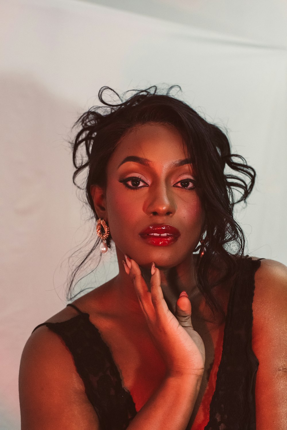 a woman in a black dress posing for a picture