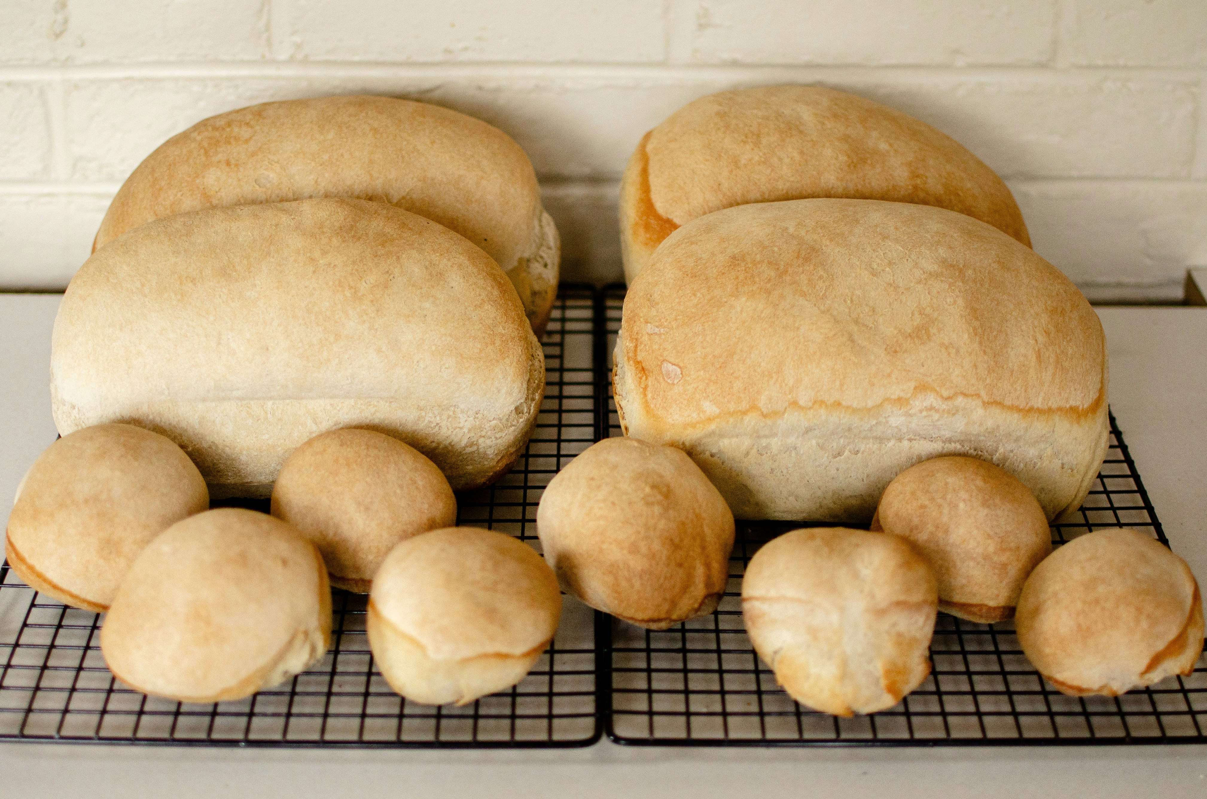 a loaf of bread sitting on a cooling rack