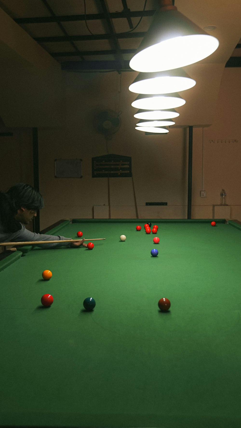 a pool table with several balls on it