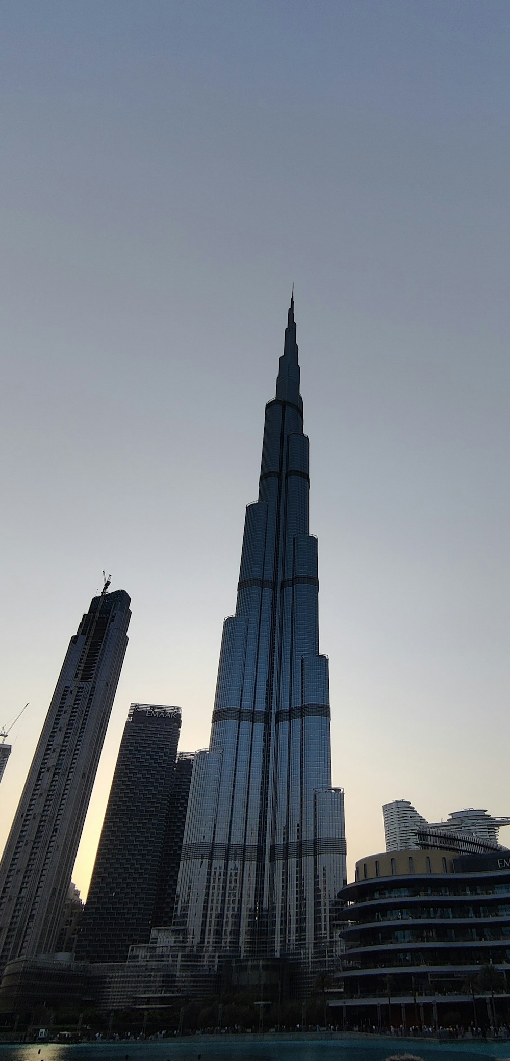 a very tall building towering over a city