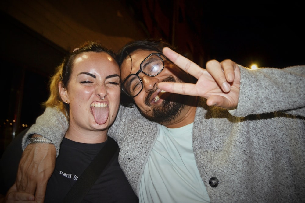 a man and a woman making a silly face