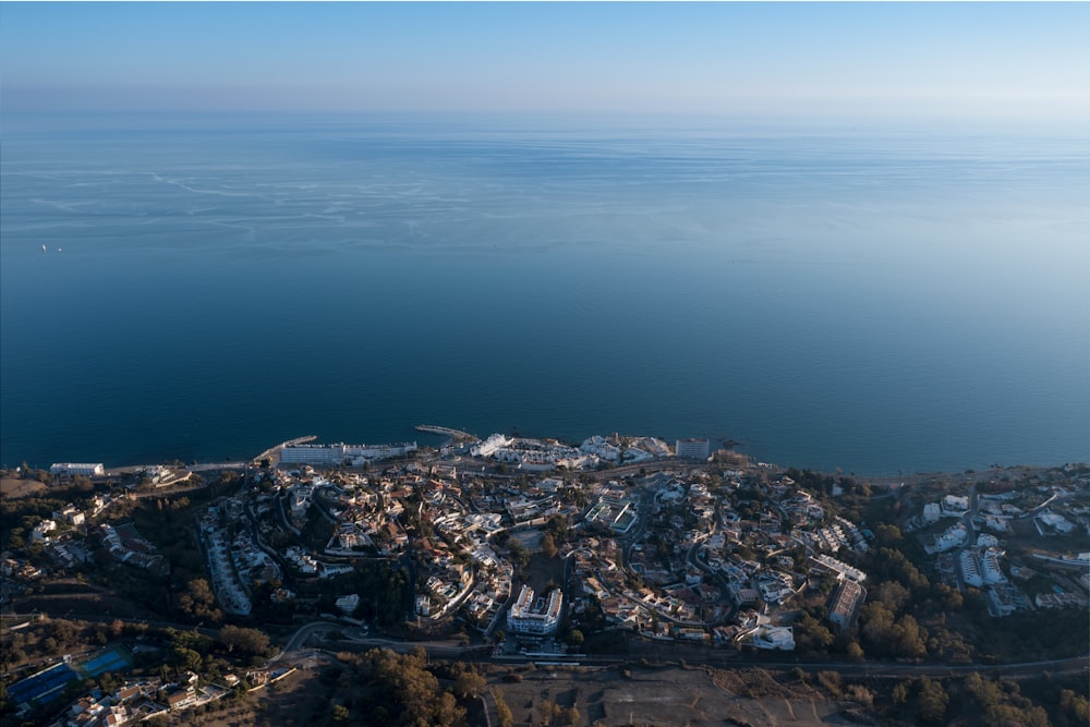 an aerial view of a city by the water