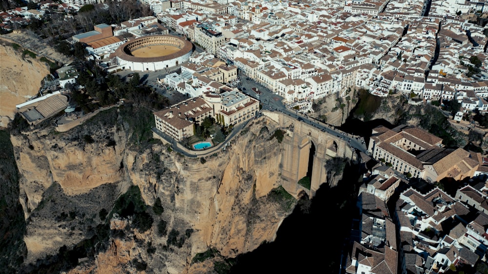 an aerial view of a city on a cliff