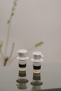 a couple of cups sitting on top of a table