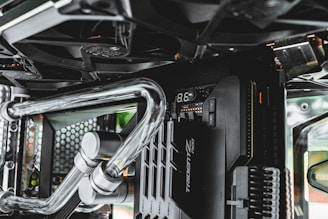 a close up of a computer case with metal pipes