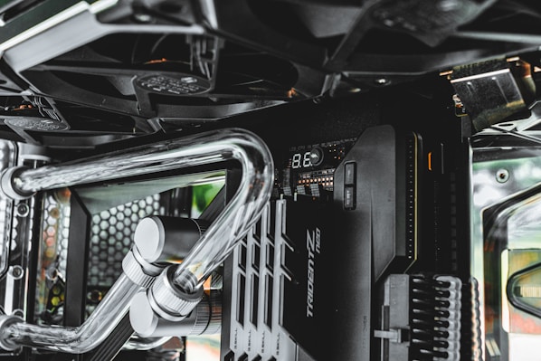 a close up of a computer case with metal pipes