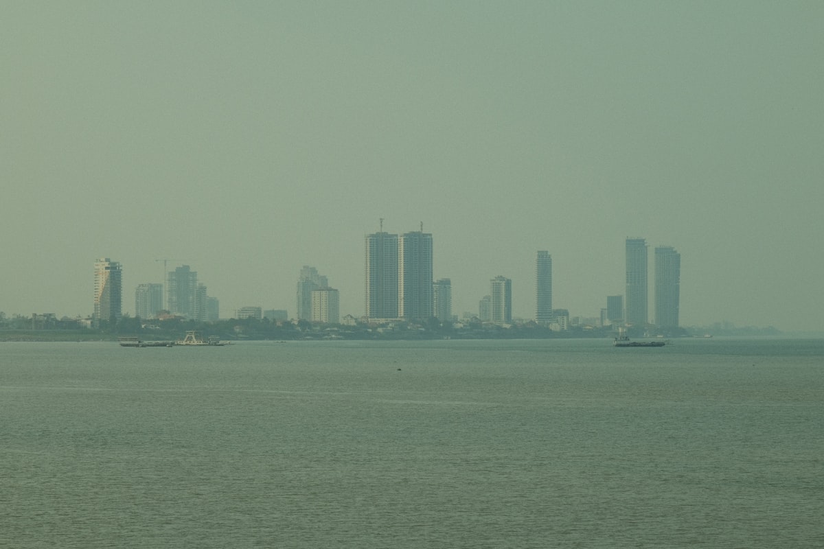 Phnom Penh October — city skyline seen across the Mekong river as the Water Festival season approaches