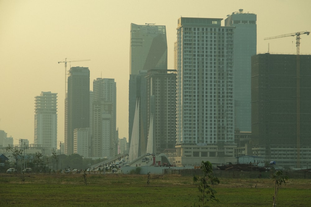 a view of a city with tall buildings in the background