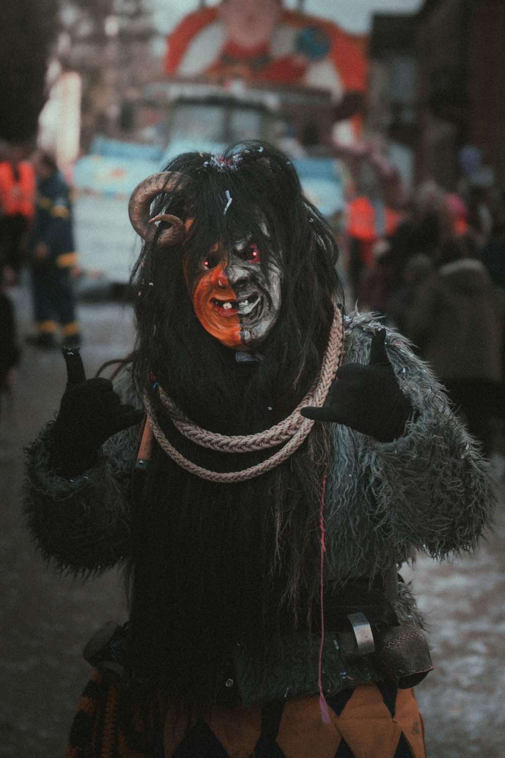 a man dressed in a costume with horns and a nose ring