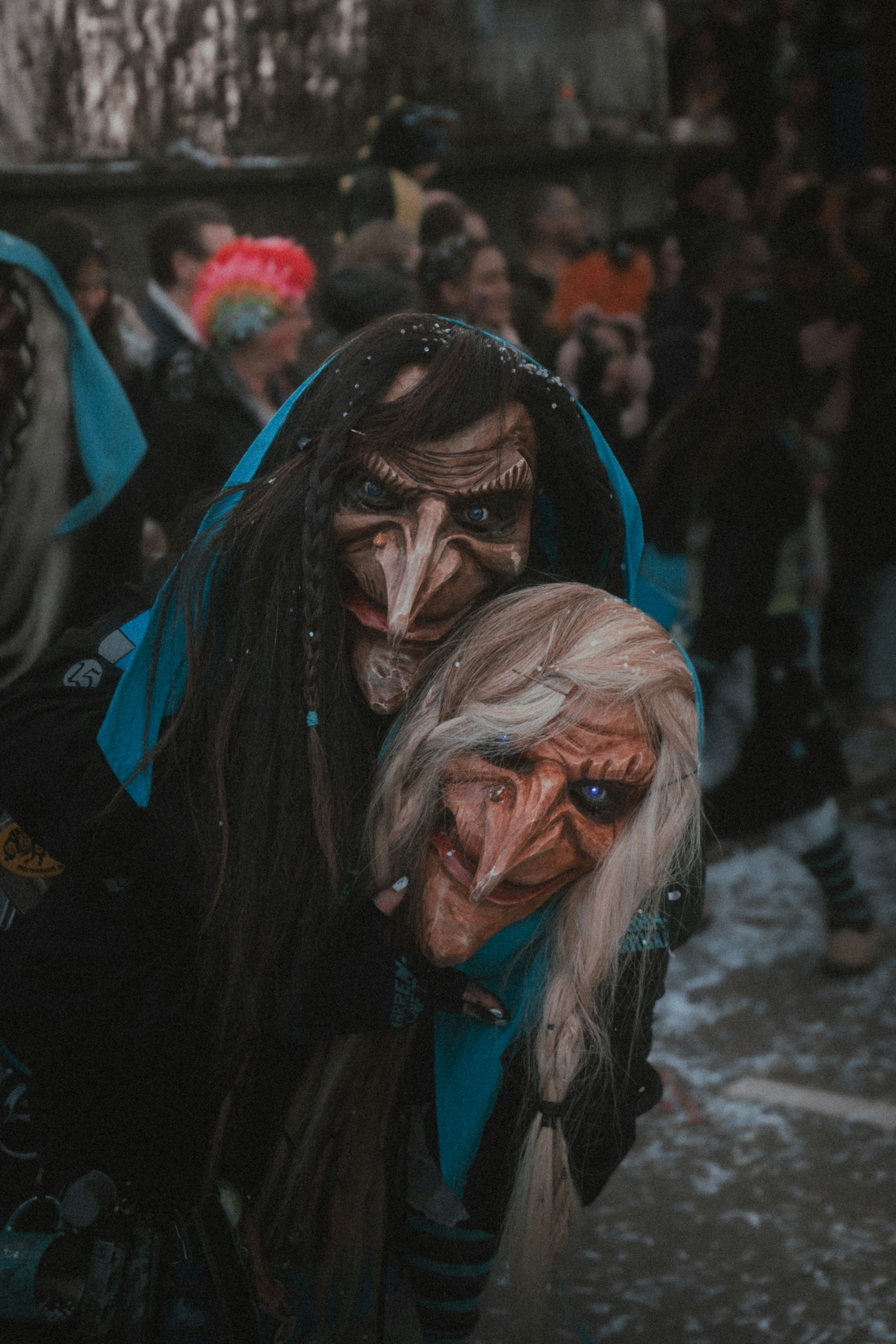 a person with a long hair and a mask on