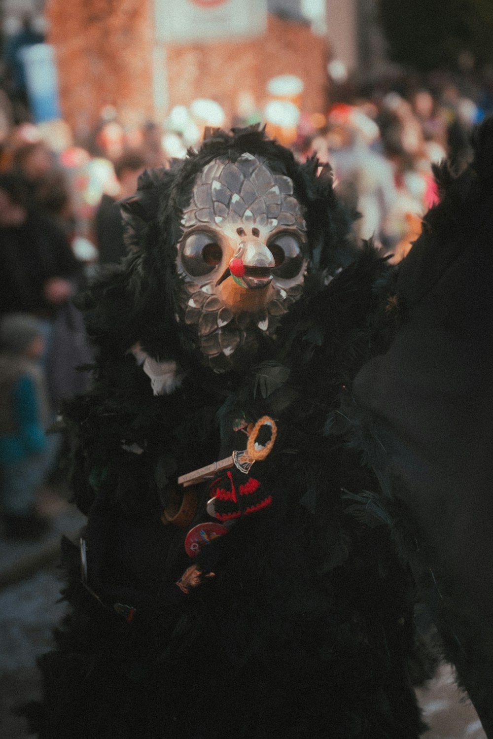 a masked person holding a pair of scissors