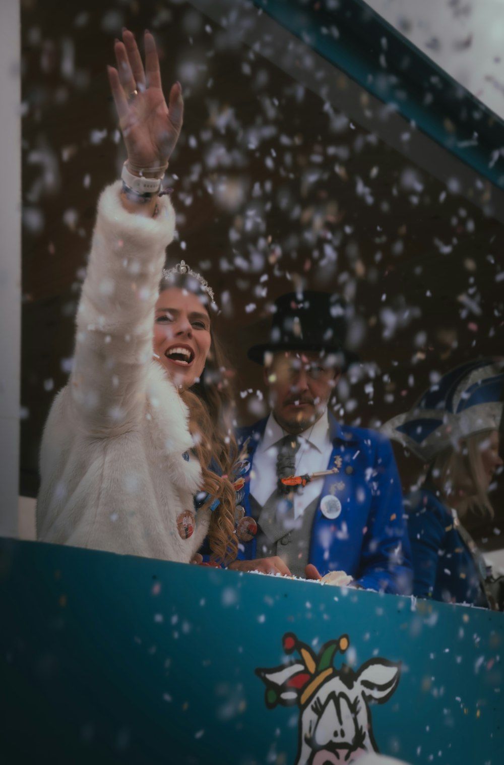 a couple of people that are standing in the snow