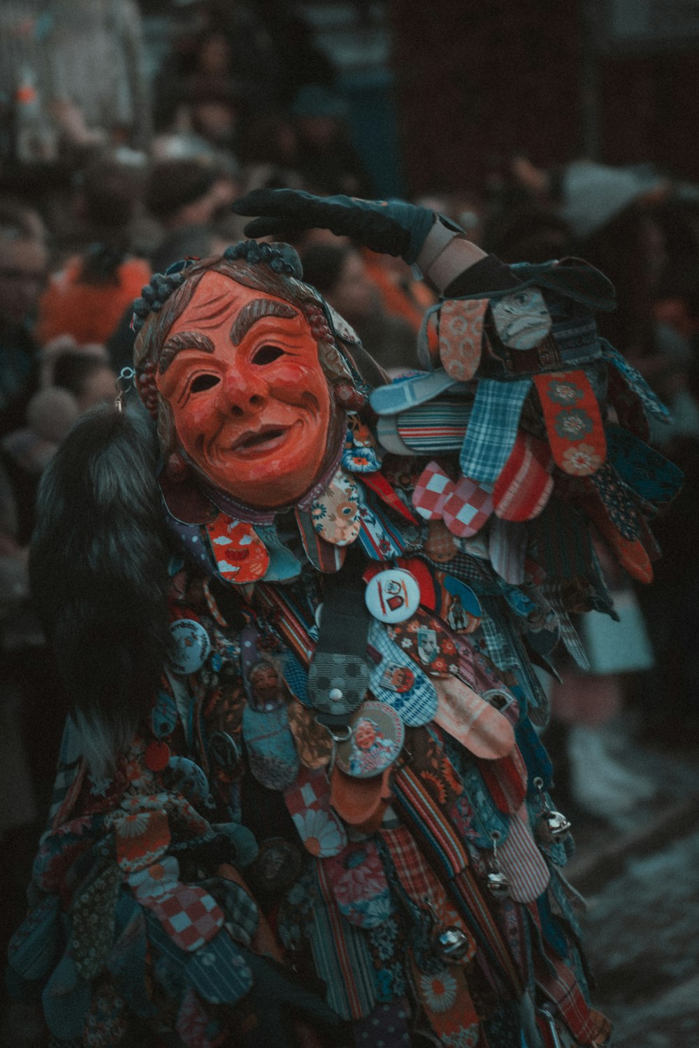 a person with a mask on and a bird on his shoulder