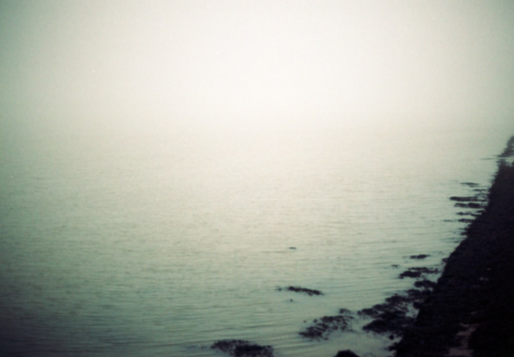 a foggy view of a body of water