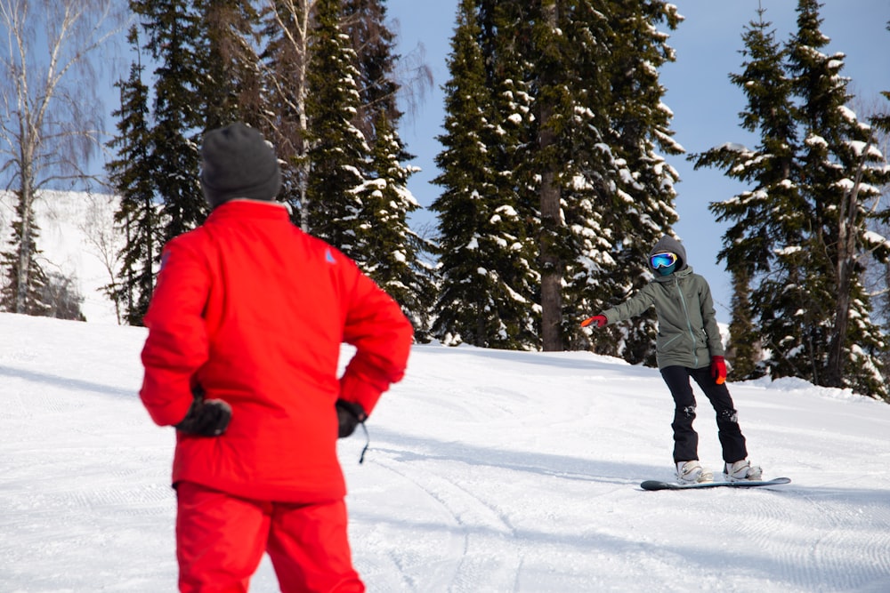 two people on snowboards in the snow