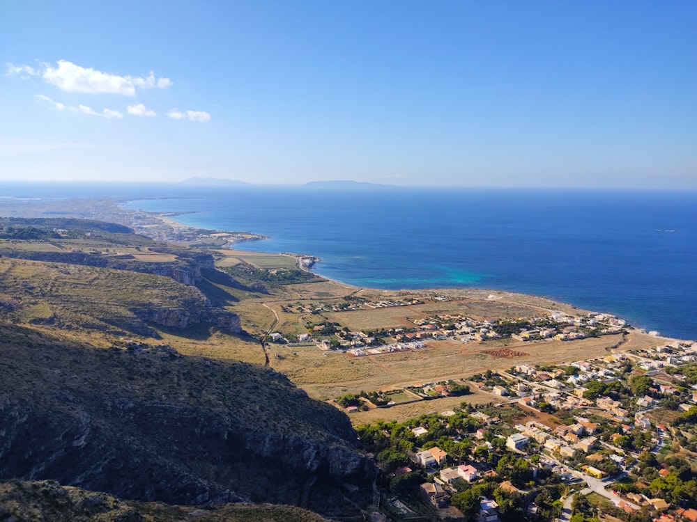 an aerial view of a small town near the ocean