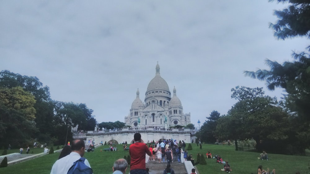 a group of people walking up a set of stairs