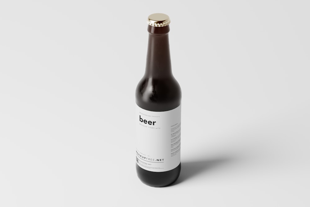 a bottle of beer sitting on top of a white table