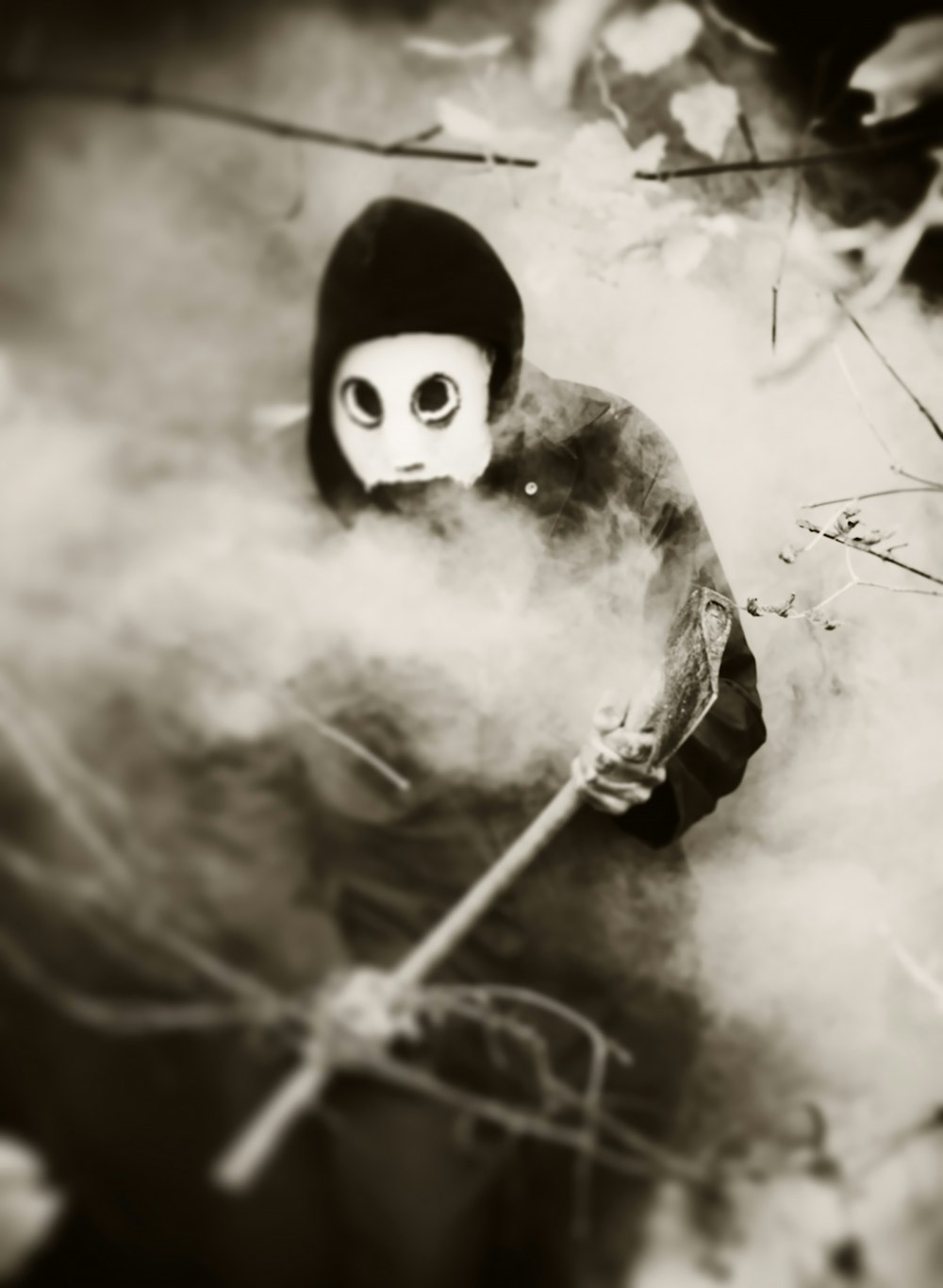 a person wearing a mask and holding a stick