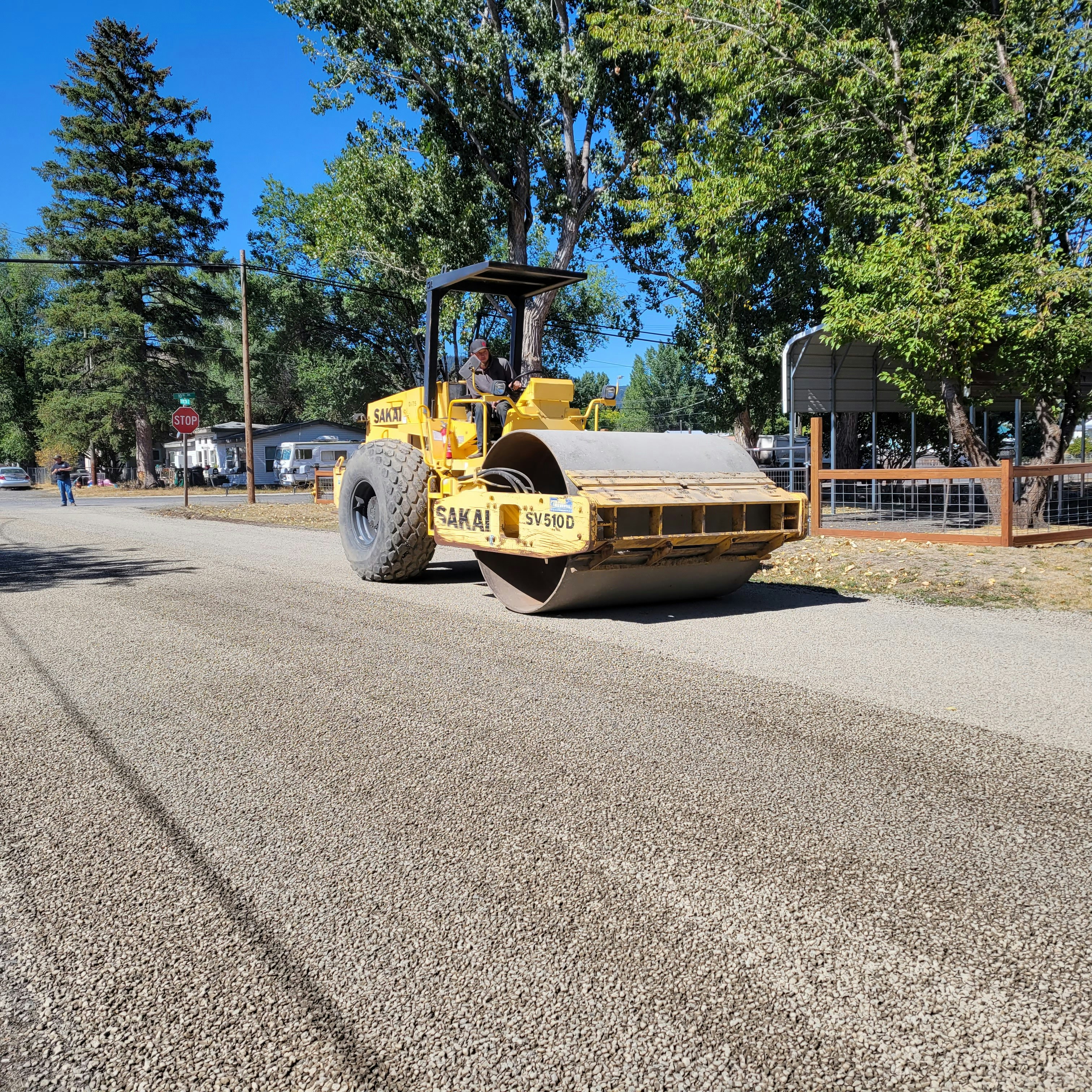 a bulldozer is parked on the side of the road