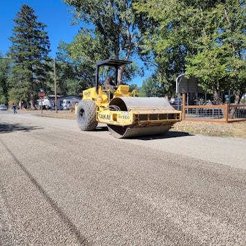 a bulldozer is parked on the side of the road