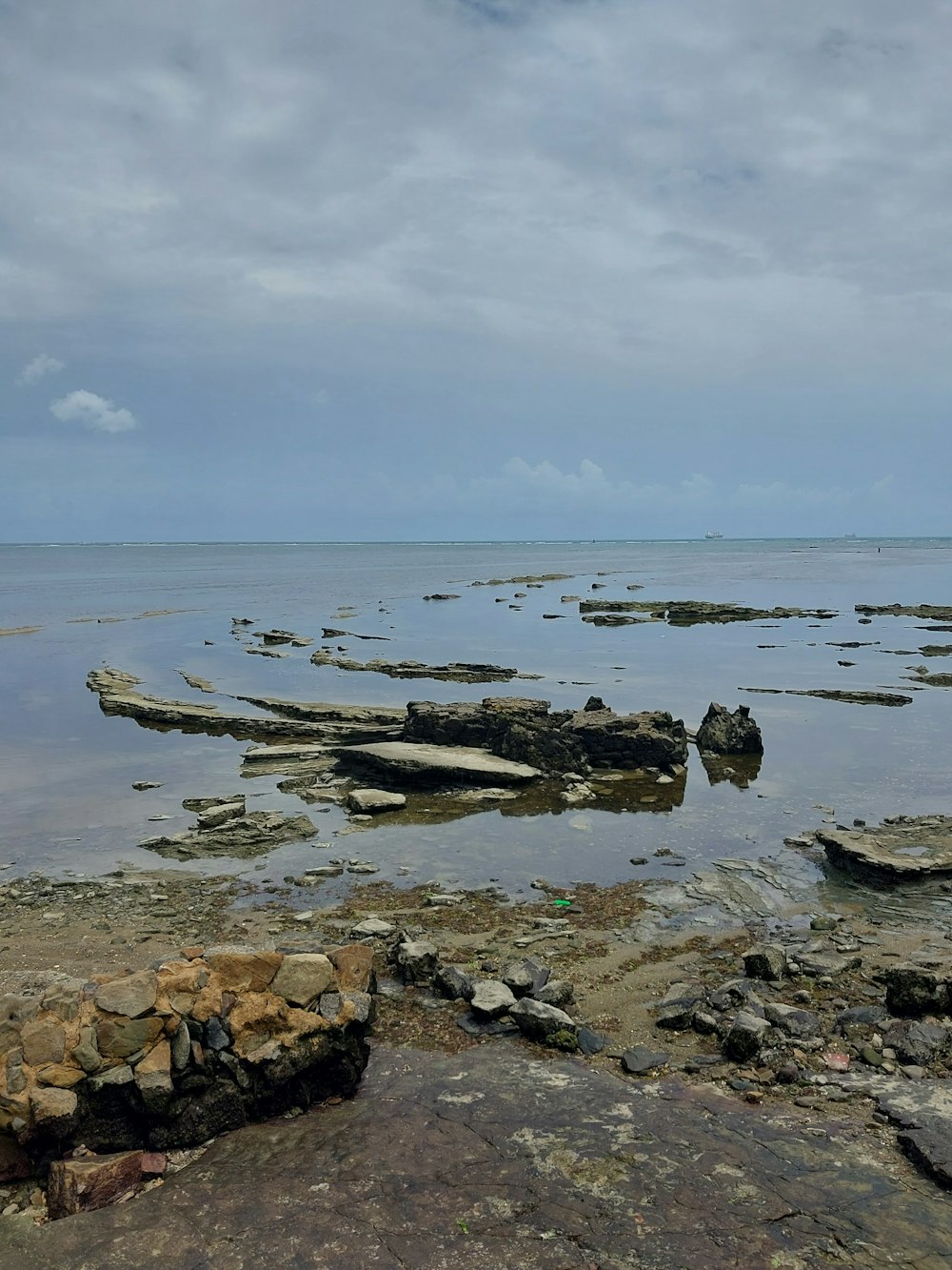 a large body of water surrounded by rocks