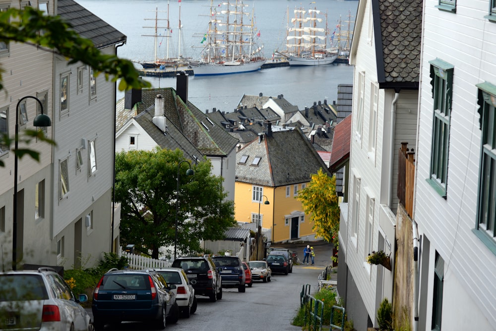 a view of a city street with boats in the water