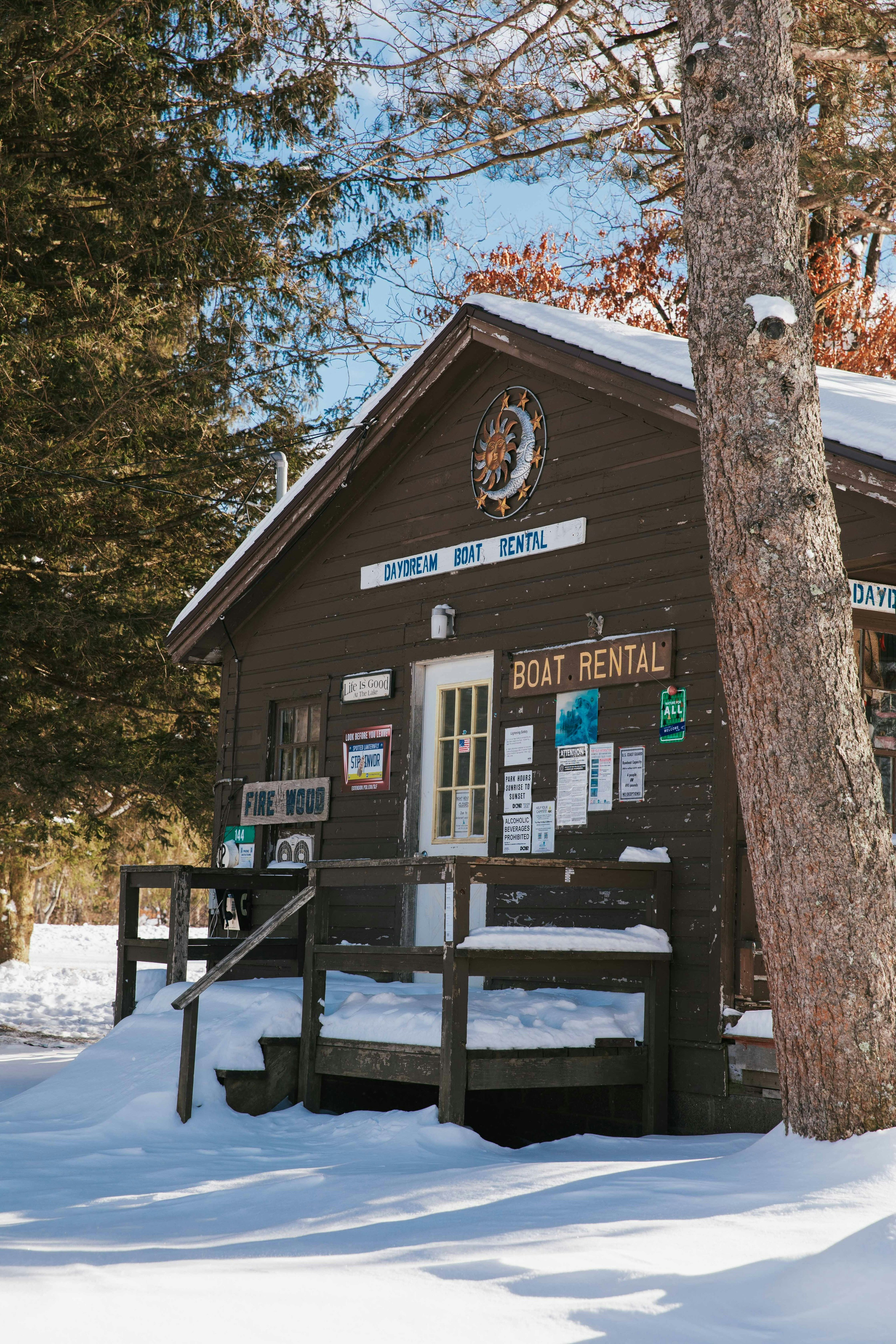 a wooden building with a sign on the front of it