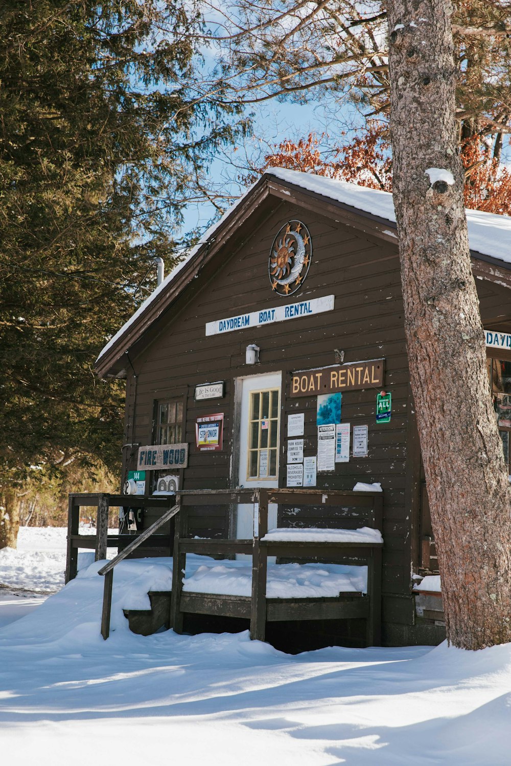 a wooden building with a sign on the front of it